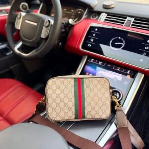 Gucci GG Stripe Compact Crossbody Bag — view 1 Gucci GG Stripe Compact Crossbody Bag — view 1