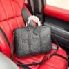 Gucci GG Embossed Top-Handle Bag — view 1