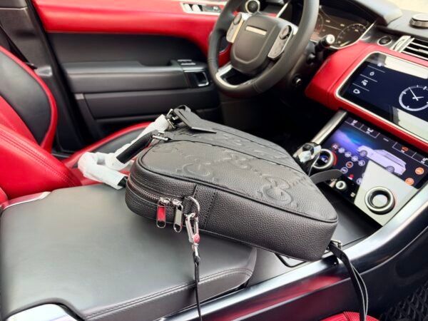 Gucci GG Embossed Top-Handle Bag — view 7